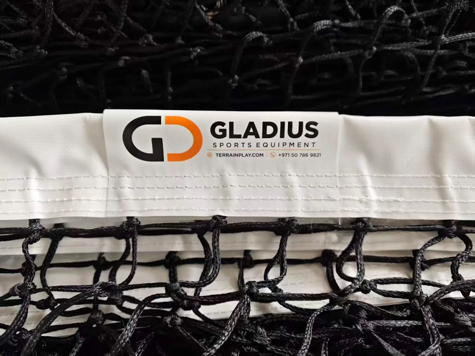 Gladius padel net with branded white top band and knotted black mesh