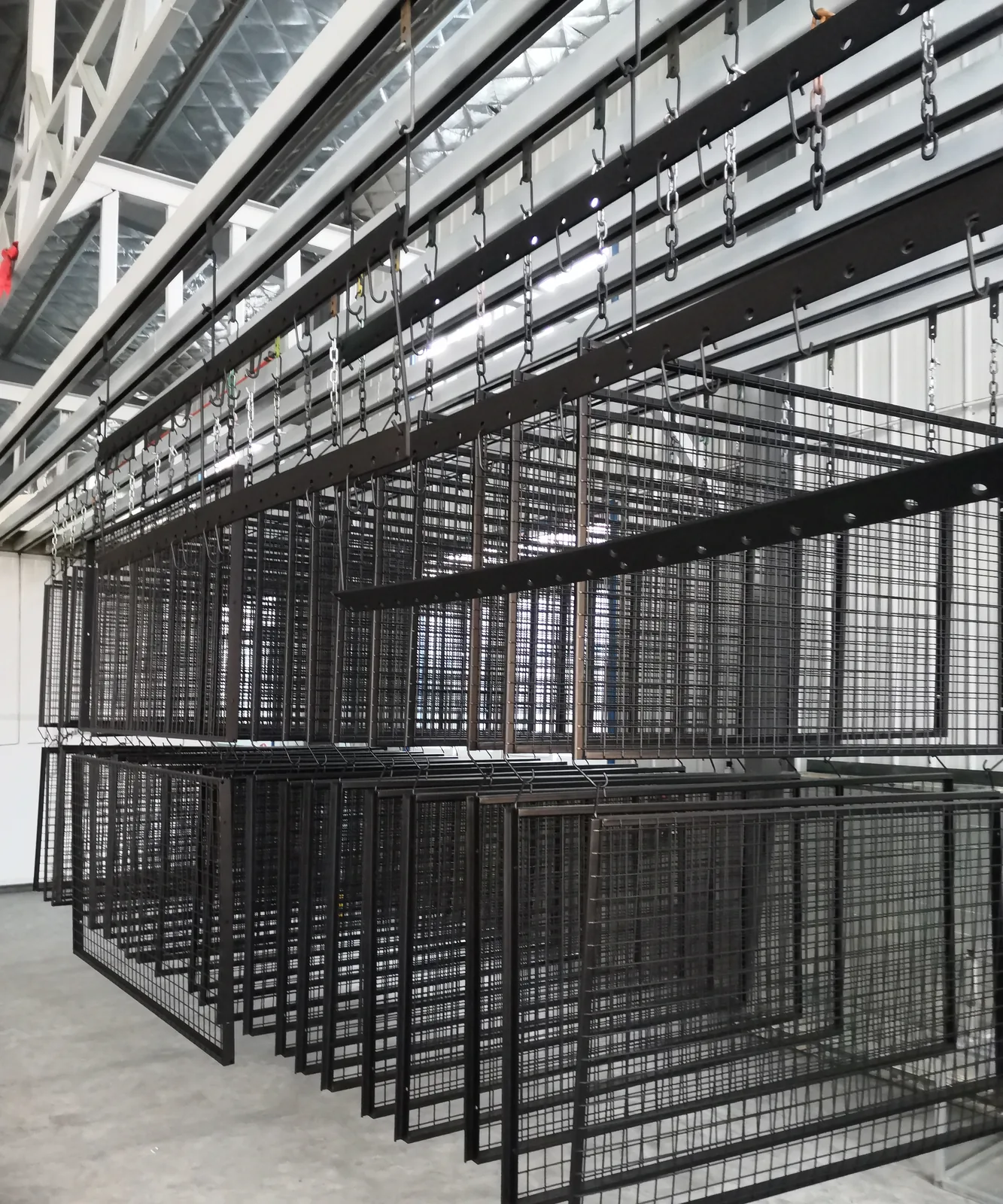 Black powder-coated steel padel frames with welded mesh